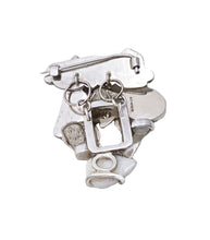 Load image into Gallery viewer,  This white coral brooch is about recreating a memory of a white beach. There are two parts of the brooch: one is a hand textured silver piece with a brooch pin and another is decorative silver corals with shells, a coral and a rutilated quartz. They are connected together with two jump rings behind the brooch allowing it make some movement.  Sterling silver, dead coral and shells from a beach in Okinawa, Japan Stone: rutilated quarts Approx. 40mm x 50mm x 15mm