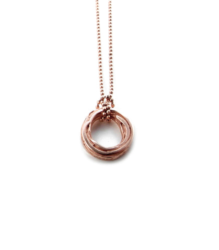 by Yuki Assiter  Small Pond Ripple inspired disc with a diamond cut ball chain necklace in rose gold.  This ‘Small’ Pond Ripples Disk is slightly smaller than ‘Pond Ripple’ disk necklace. The small disk looks more delicate and still has a lot of fine lines and details. The pendant top is attached on a diamond cut ball chain with an adjuster chain.  Disk: approx. 15mm diameter x 2.5mm height. Diamond cut ball chain: 1mm thickness, adjustable length: approx. 400- 430mm.